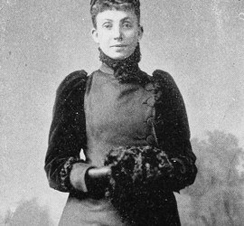 Photograph of a Victorian woman in a black dress, hair piled on her head. Mary Hannah Krout completed Lew Wallace's autobiography.