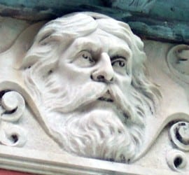 Limestone face of the Prince of India carved into the frieze that surrounds the outside of the Study building