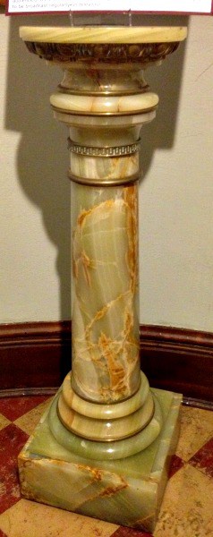 An onyx pedestal from Rome, pale green with gold and white marbling
