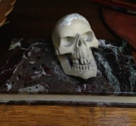 Memento Mori, a paperweight with a white skull resting on a black book