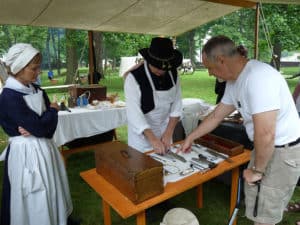 A reenactor portrays a surgeon in Civil War encampment