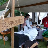 A reenactor portrays a surgeon in Civil War encampment