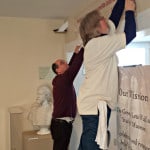 Grounds Mananger Deb King and Museum Director Larry Paarlberg work on the exhibit