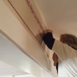 Grounds Manager Deb King mounts acrylic for the Vindication exhibit at the General Lew Wallace Study & Museum