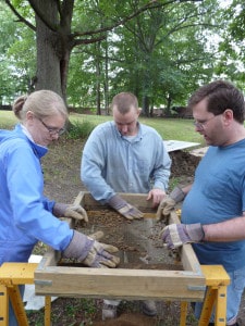 Workers screen dirt during History Beneath Us archaeology