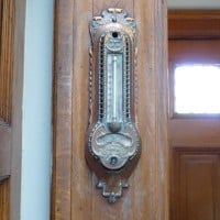 The original thermostat to the Study building; it is made of brass and is highly decorative