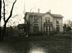Wallace family house viewed from the south. It is a two-story Victorian home with the entrance facing west.