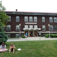 The old Crawfordsville High School, currently the Athena Center. It is a large brick building.