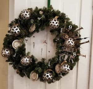 A steampunk-inspired wreath with gears, keys, and numbers, designed by Kara Edie