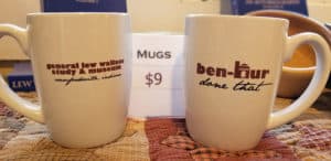 Two mugs are side by side. One says "General Lew Wallace Study & Museum, Crawfordsville, Indiana" and the other says "Ben-Hur Done That."