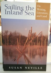 Cover of a book with a lake and dead trees; Sailing the Inland Sea by Susan Neville